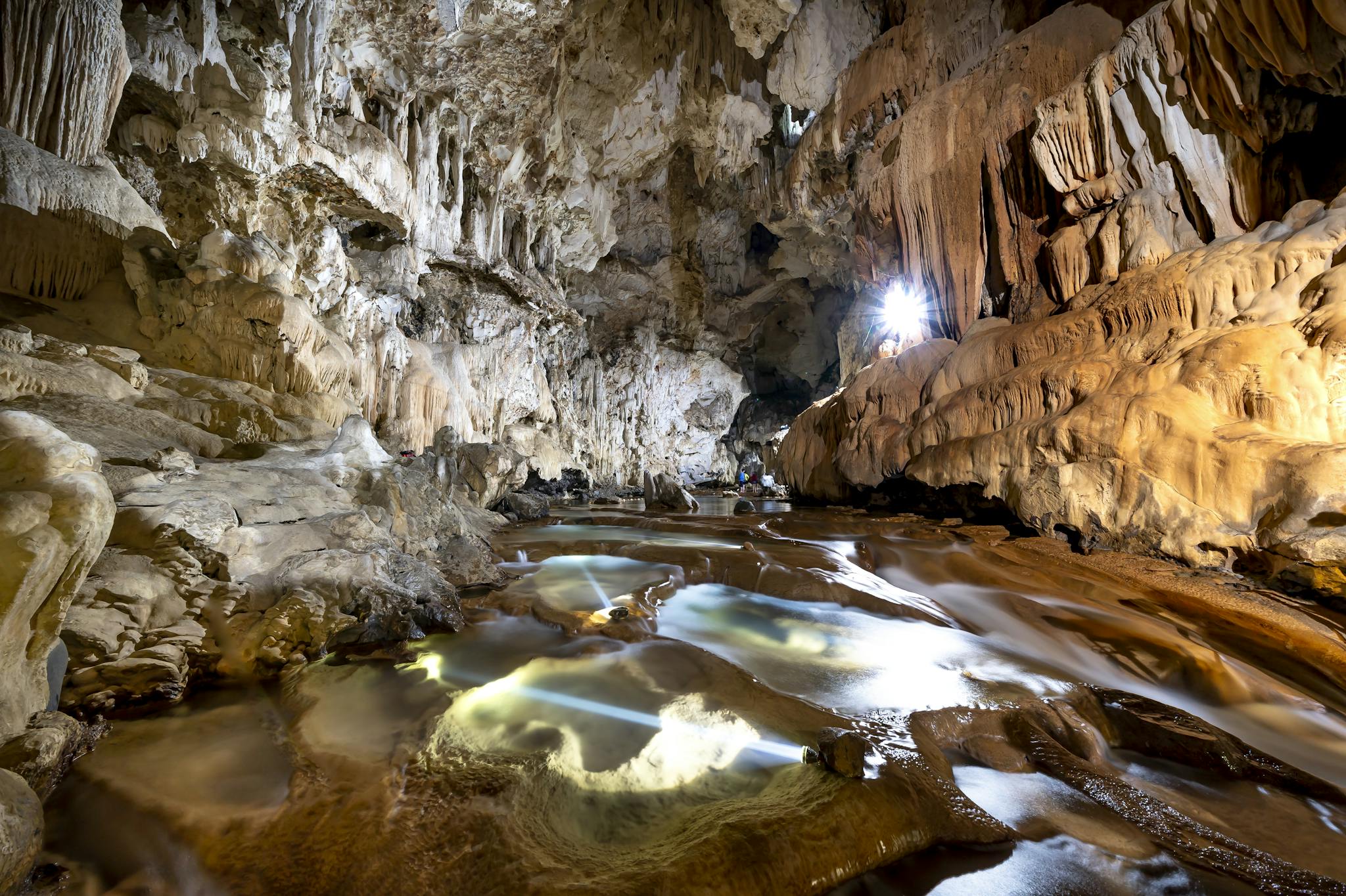 Explore the breathtaking rock formations and illuminated waters of this mysterious underground cave.